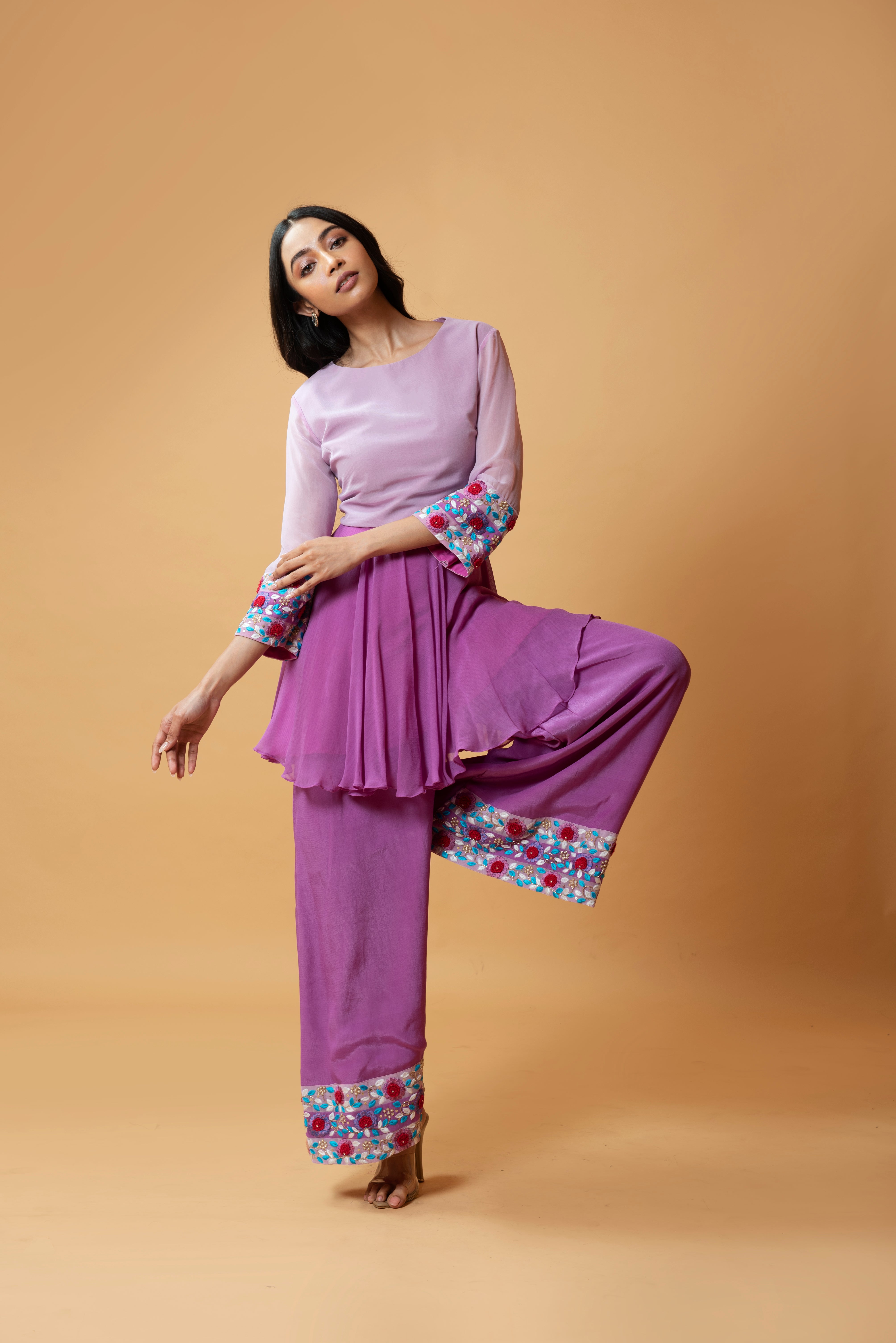 Lavender double-shaded sharara set with intricate floral embroidery.